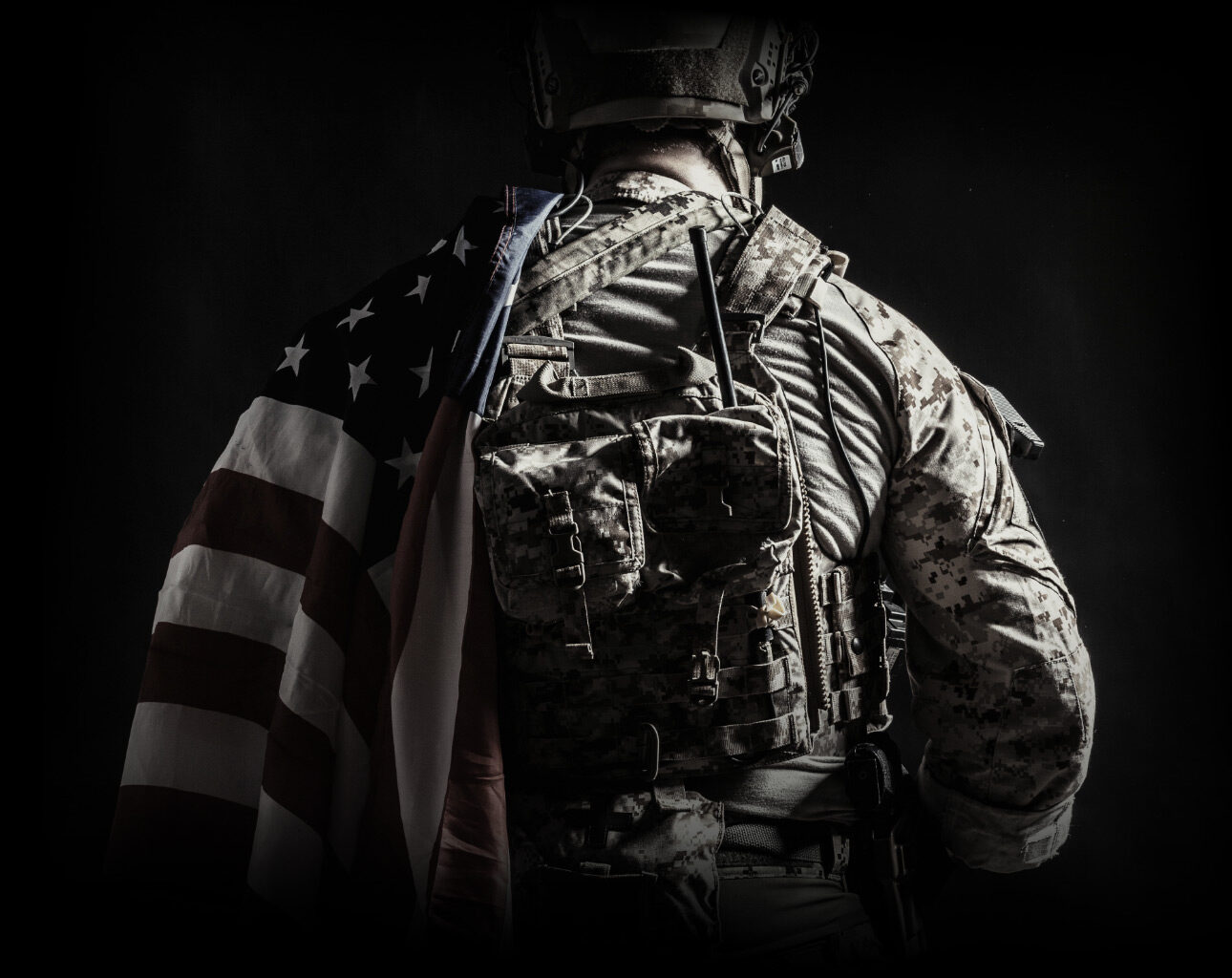Soldier Wearing a flag on their left shoulder with their back turned